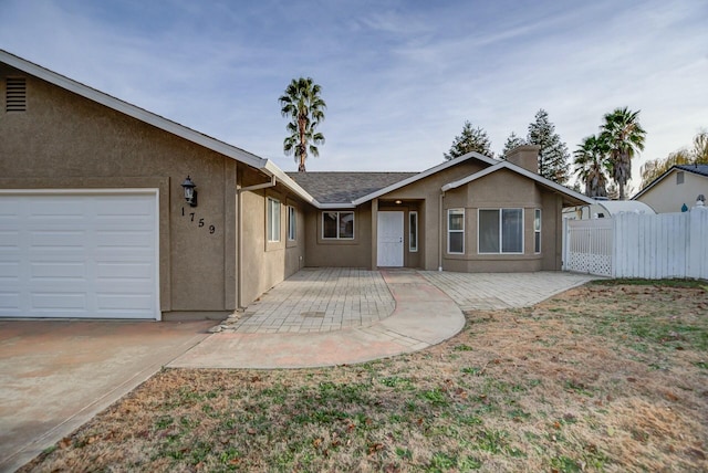 ranch-style house featuring a garage