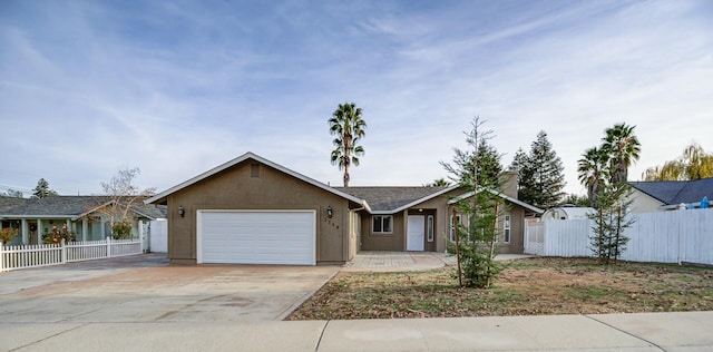 single story home featuring a garage