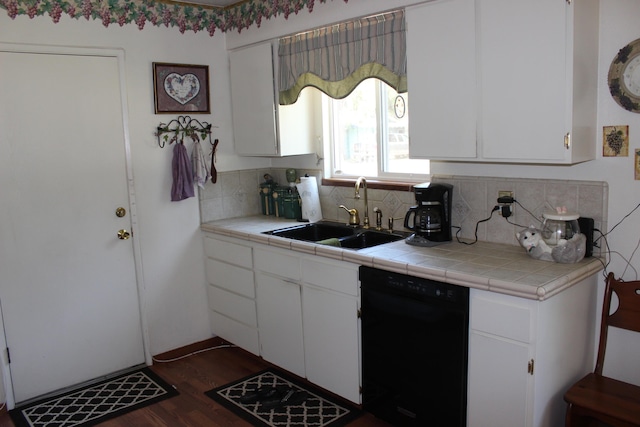 kitchen featuring white cabinetry, tile counters, and black dishwasher