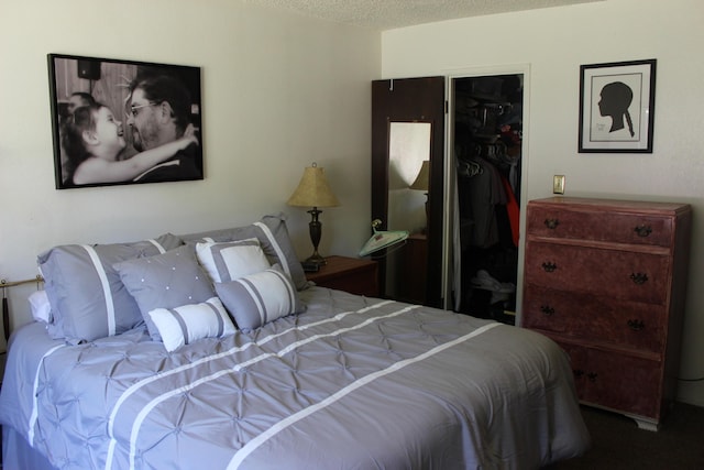 bedroom featuring a closet and a textured ceiling