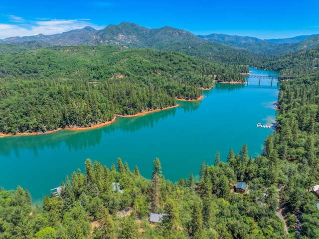 aerial view featuring a water and mountain view