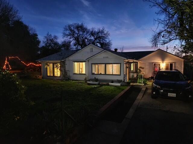 view of front of home with a lawn