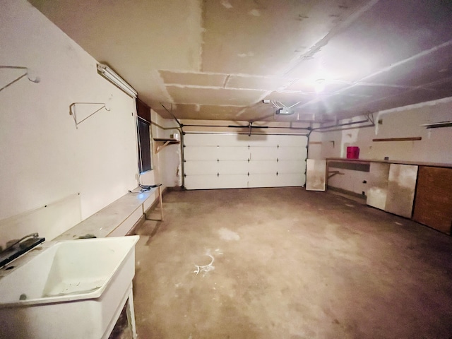 garage featuring sink and a garage door opener