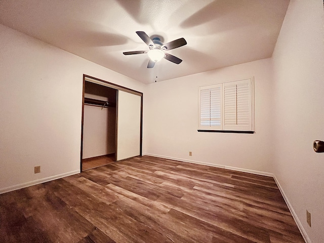 unfurnished bedroom featuring wood-type flooring, a closet, and ceiling fan