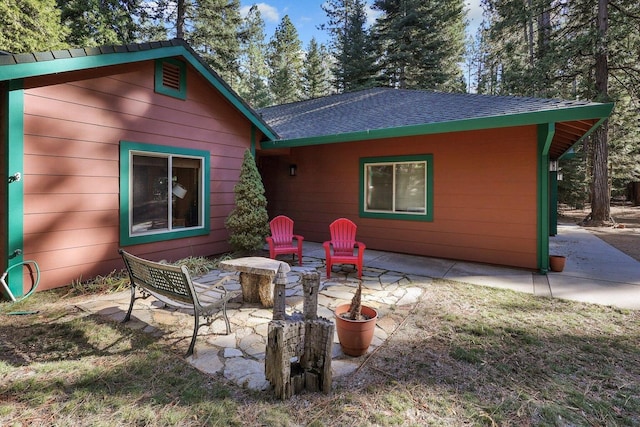 rear view of house featuring a patio