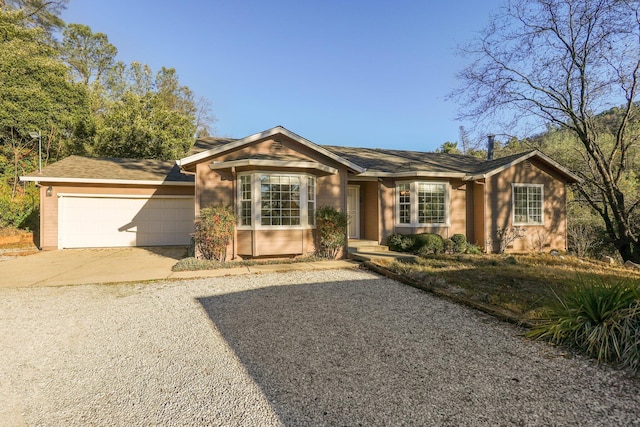 single story home featuring a garage