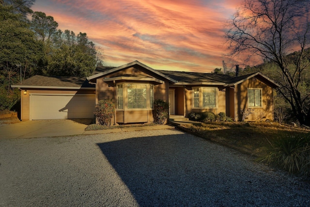 ranch-style home with a garage