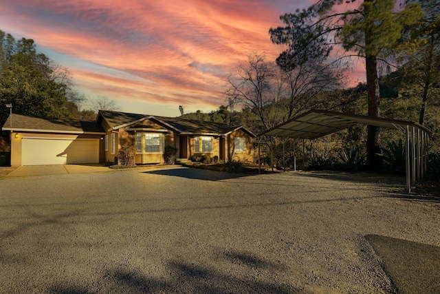 view of front of house featuring a carport and a garage