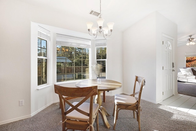 dining room featuring light carpet and ceiling fan with notable chandelier