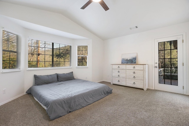 carpeted bedroom featuring multiple windows, ceiling fan, and vaulted ceiling