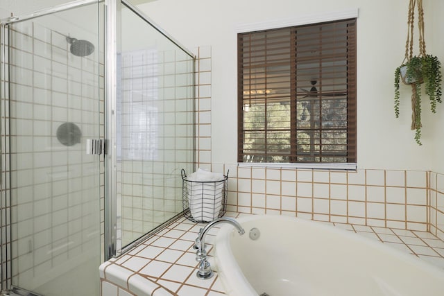 bathroom featuring shower with separate bathtub and ceiling fan