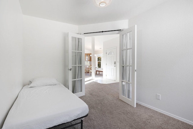 bedroom featuring carpet and french doors