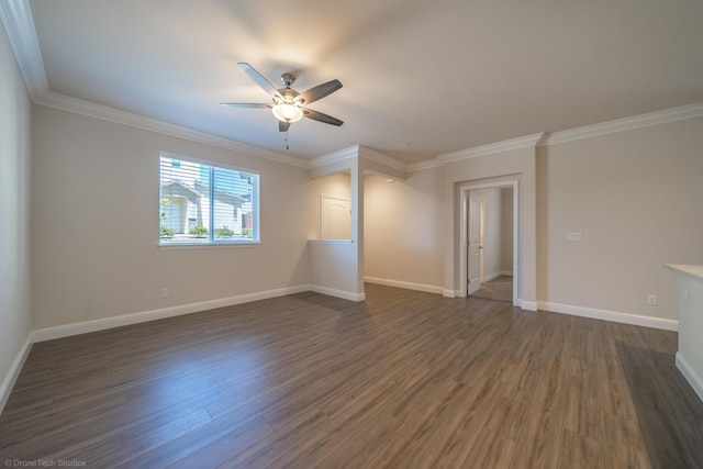 unfurnished room with crown molding, ceiling fan, and dark wood-type flooring