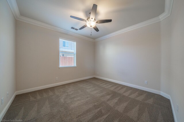 spare room featuring carpet, ceiling fan, and ornamental molding