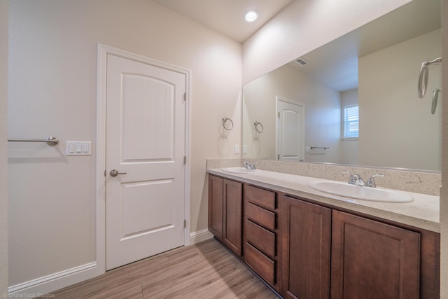 bathroom featuring wood-type flooring and vanity