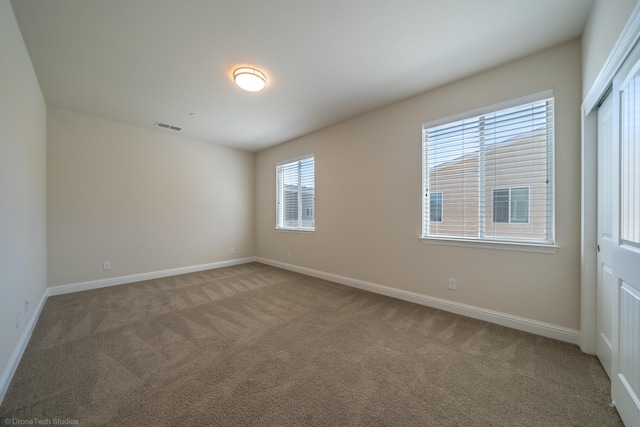 empty room with carpet flooring