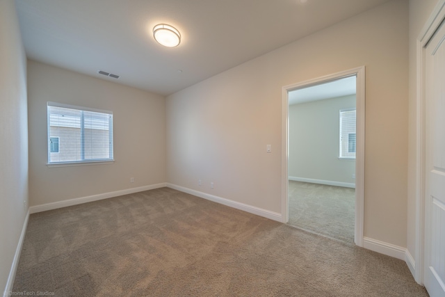 empty room with carpet flooring