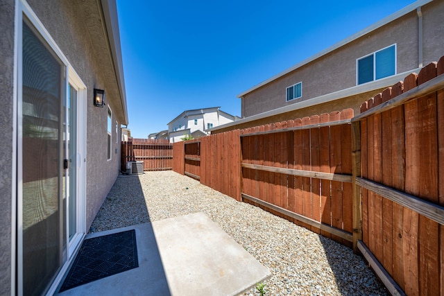 view of yard with a patio and central AC