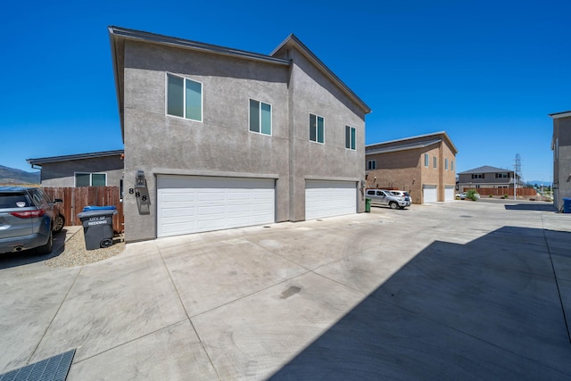 view of side of property with a garage