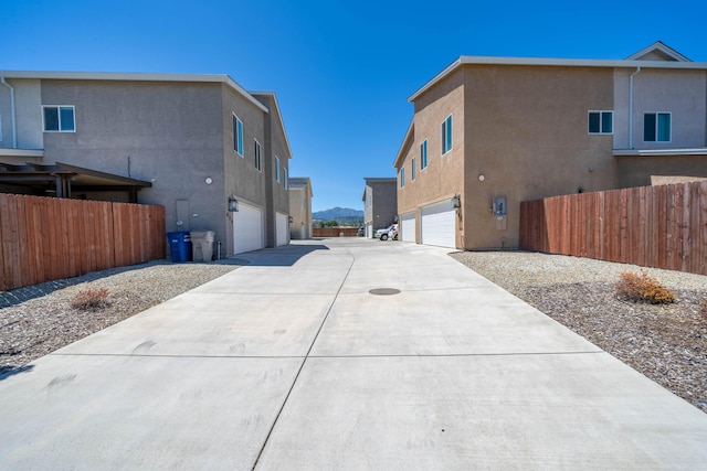 view of home's exterior featuring a mountain view and a garage