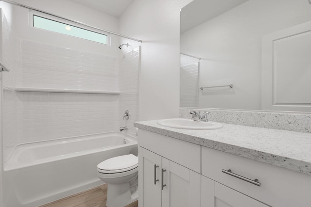 full bathroom featuring bathing tub / shower combination, vanity, wood-type flooring, and toilet