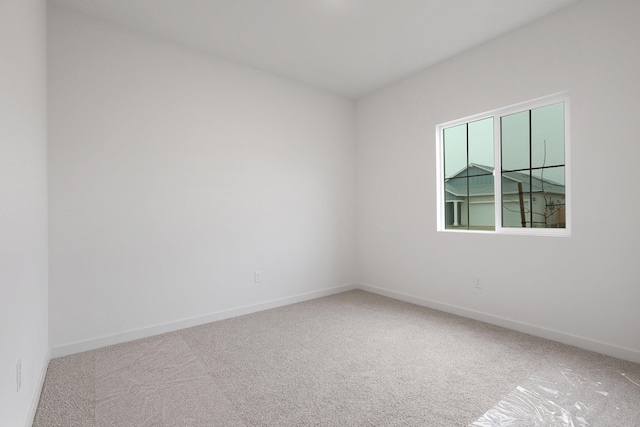 unfurnished room with carpet flooring