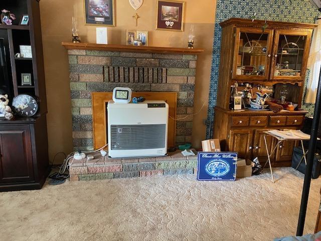 37412 Birch Ave, Burney, CA 96013 - detailed view of carpet, a fireplace, and heating unit