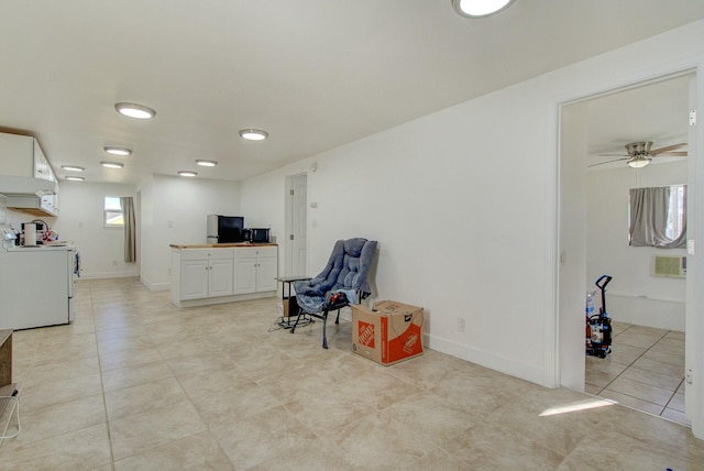 interior space featuring ceiling fan and light tile patterned flooring