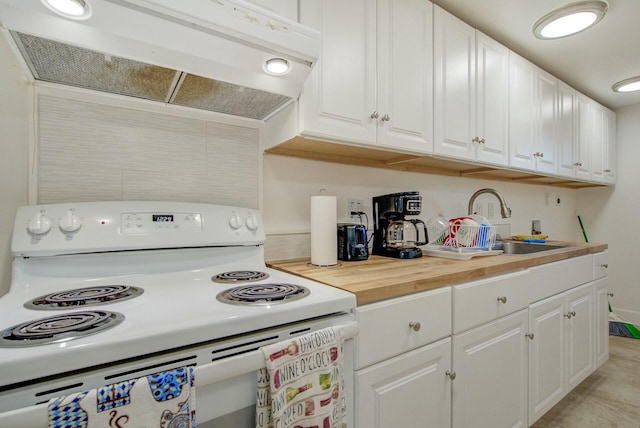 kitchen featuring ventilation hood, sink, white cabinets, and white electric stove