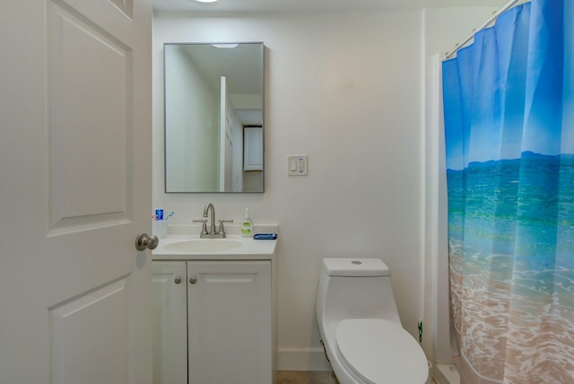 bathroom featuring vanity and toilet