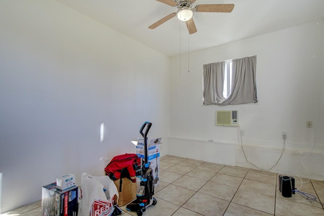 miscellaneous room featuring a wall mounted air conditioner, light tile patterned floors, and ceiling fan