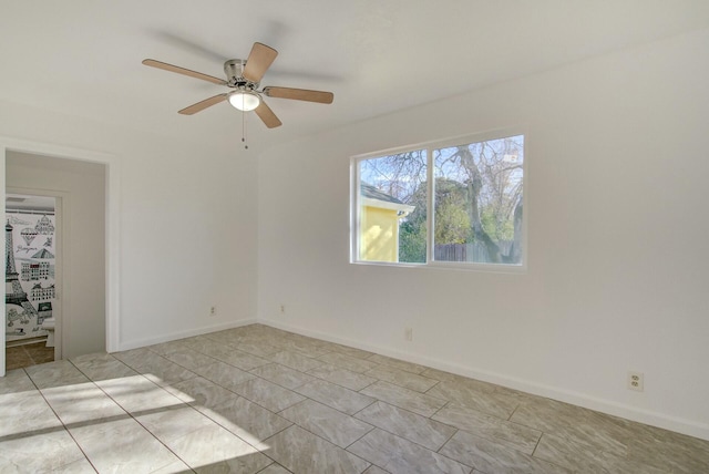 unfurnished room with light tile patterned floors and ceiling fan