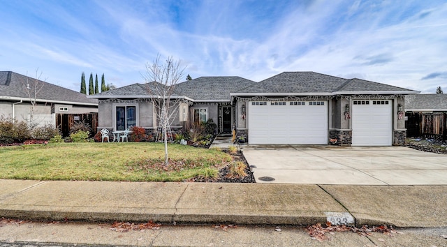 view of front of home with a front lawn and a garage