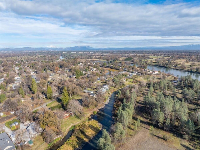 birds eye view of property featuring a water and mountain view