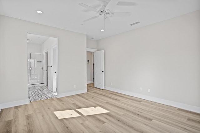 spare room with light hardwood / wood-style floors and ceiling fan