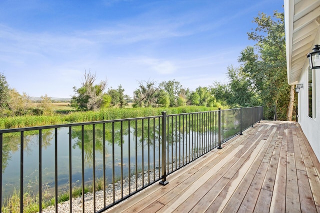 wooden deck with a water view