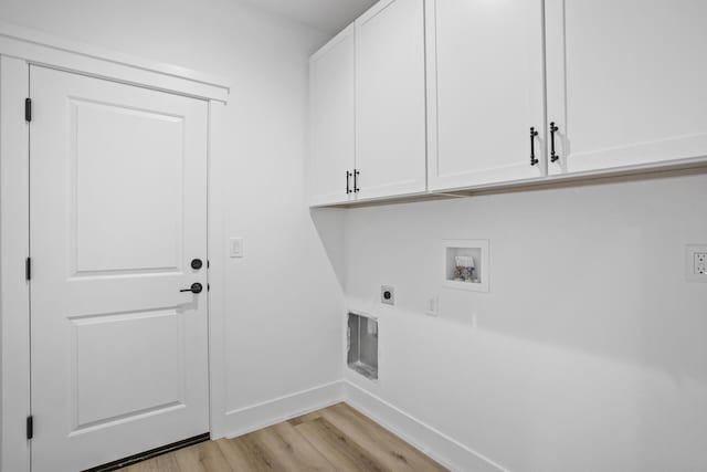 washroom with cabinets, hookup for a washing machine, light hardwood / wood-style floors, and electric dryer hookup