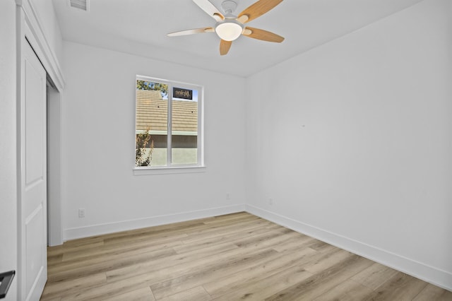 unfurnished bedroom with a closet, light hardwood / wood-style floors, and ceiling fan