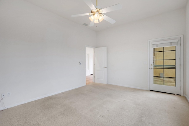 unfurnished room with light carpet, a high ceiling, and ceiling fan