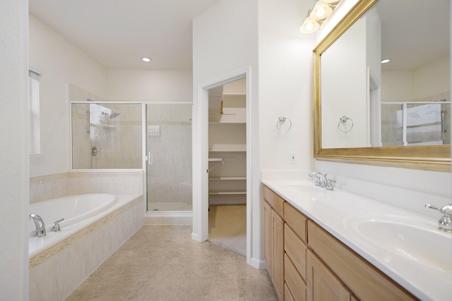 bathroom featuring plus walk in shower and vanity