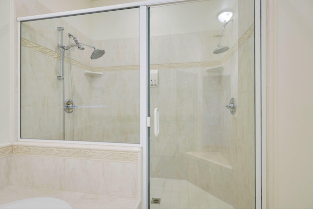 bathroom featuring an enclosed shower