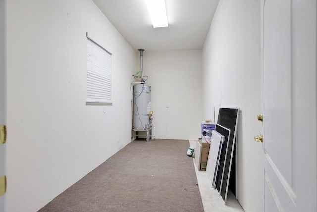 interior space with water heater and light colored carpet