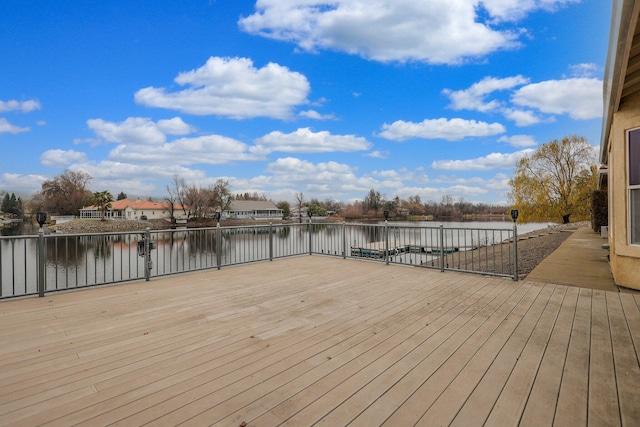 wooden deck with a water view