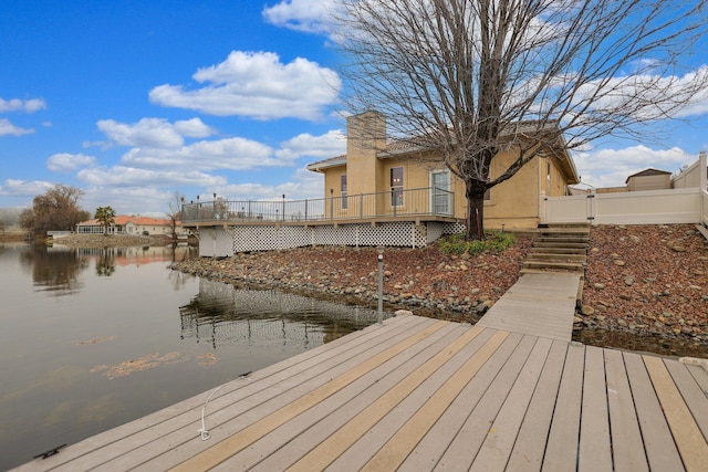 dock area with a water view