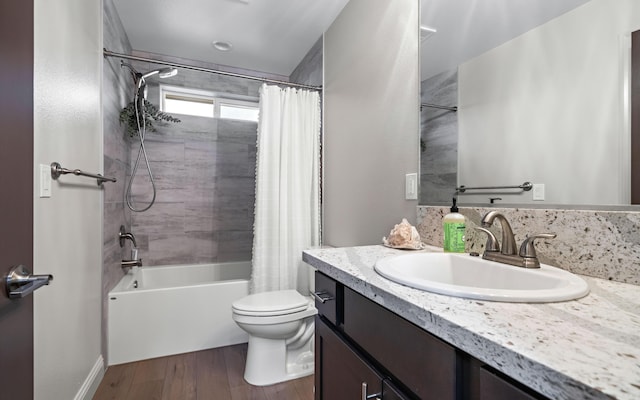 full bathroom with shower / bath combination with curtain, vanity, toilet, and hardwood / wood-style floors