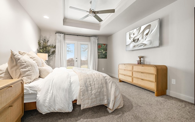 bedroom featuring access to exterior, carpet, ornamental molding, a tray ceiling, and ceiling fan