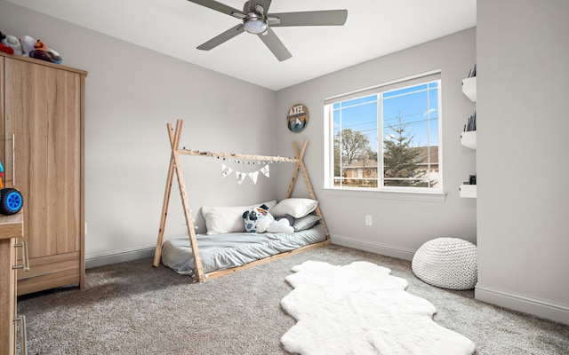 carpeted bedroom featuring ceiling fan