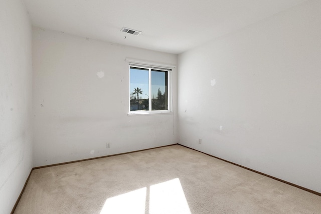 empty room with light colored carpet