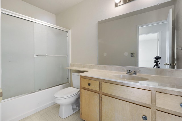 full bathroom with vanity, toilet, and combined bath / shower with glass door