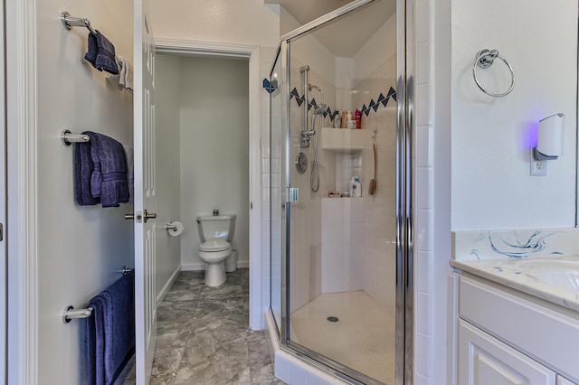 bathroom with sink, a shower with door, and toilet